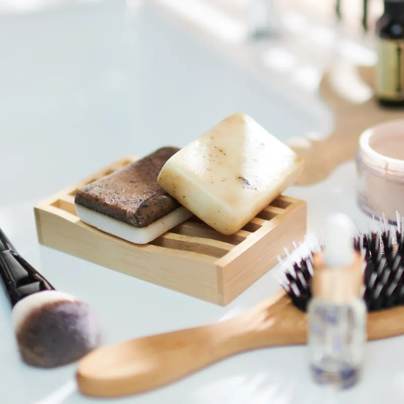 Handmade bars on a wooden soap tray