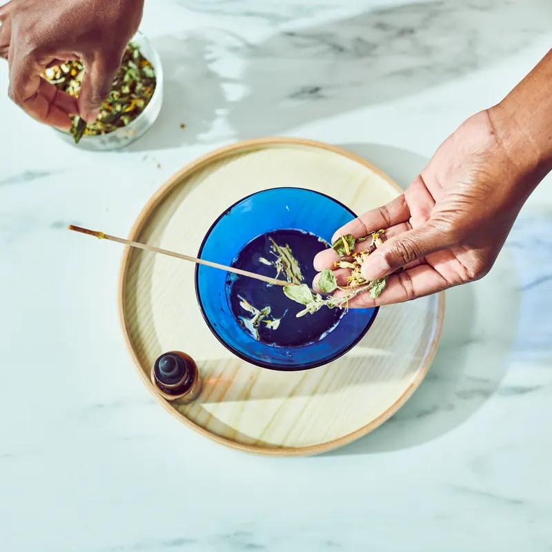 Dried botanicals sprinkled into melted clear base