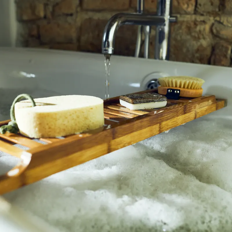 Handmade bars on a bath tray above the foam