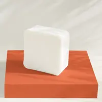 A block of mango butter soap base on a stand