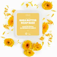 Shea butter soap base tub from above, with calendula flowers