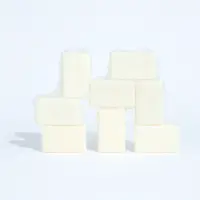 Unwrapped goat milk soap bars stacked